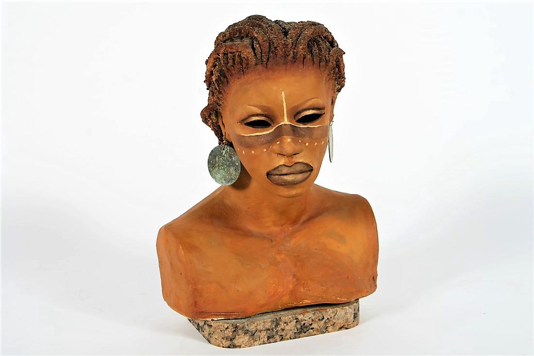 Woodrow Nash (American, 20th C.), Bust of a Woman: Woodrow Nash (American, 20th C.). Ceramic, 2007. Height: 15â€, Length: 12â€, Width: 8â€. Painted ceramic bust of an African woman by Woodrow Nash. Mounted on pink granite base. With metal dis