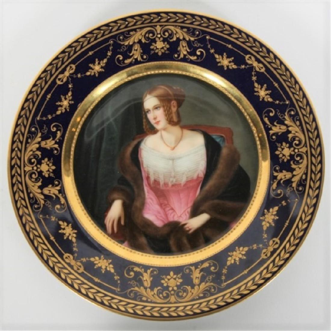 Hutschenreuther Porcelain Portrait Cabinet Plate: Hutschenreuther Porcelain Company (German, est. 1814). c. 1914-1934. Diameter: 10". Plate is hand-painted and depicts Baroness von Bernus based on an 1838 painting by Philipp Veit. Marked with the bar
