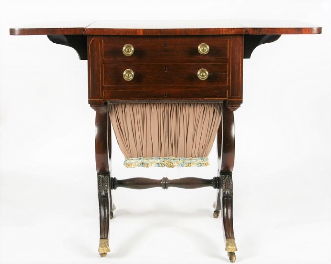 Early 19th C. Duncan Phyfe Style Work Table: Rosewood, mahogany. American, c. 1810-1820. Height: 29 5/8", Length: 20 1/4", Depth: 20". Length (extended): 37 5/8". Table features rosewood surface, two drop leaves, two drawers with double brass kn