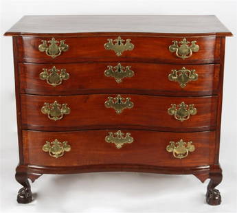 18th C. Chippendale Style Chest of Drawers: Mahogany. Massachusetts, c. 1770. Height: 33 1/2", Length: 40 1/2", Depth: 21". Carved chest features four graduated drawers, an oxbow front with blocked ends and original willow brass handles, as wel