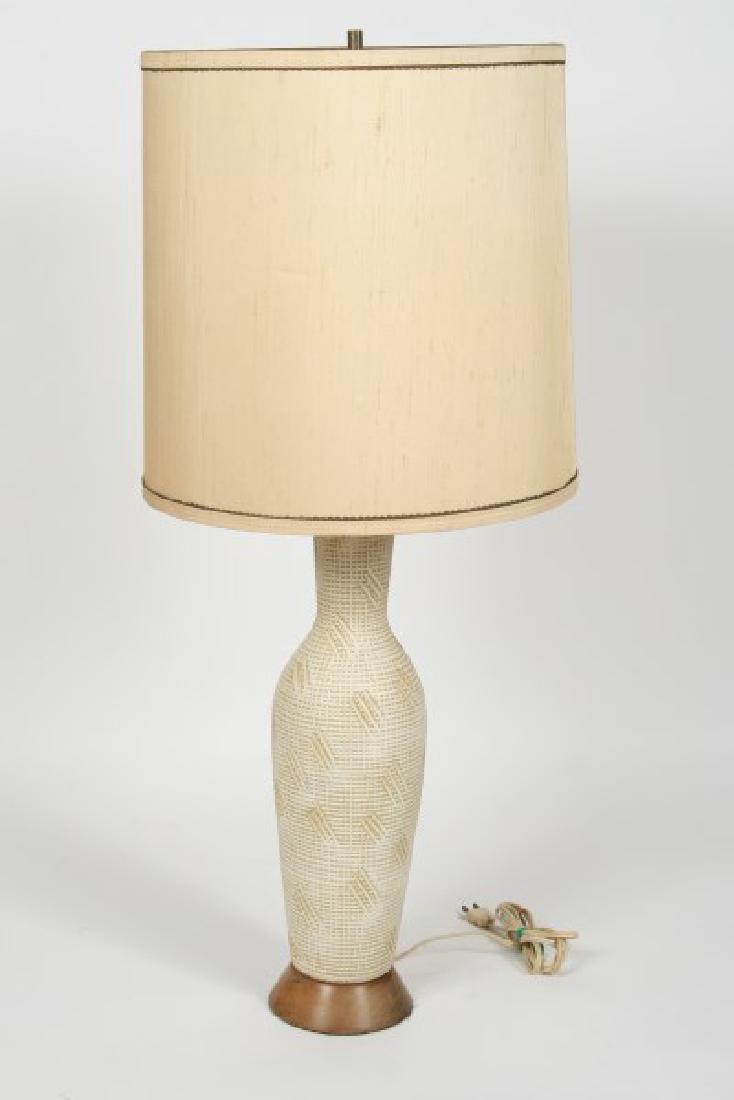 Lee Rosen for Design Technics, Table Lamp: Lee Rosen (American, 20th C.). Produced by Design Technics. Height: 33", Base: 5" diameter, Shade: 13" diameter. Table lamp displays sgraffito texture on two-toned ceramic, matching beige cylinder sha