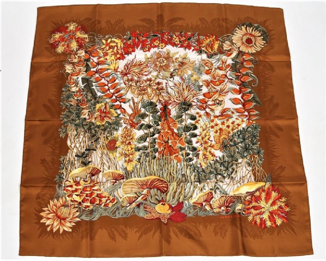 Hermes, "L'Ile Deserte" Silk Scarf in Brown: Designed by Annie Faivre. "L'Ile Deserte". Silk. Designed 1998. Produced by Hermes. 35" x 35". "L'Ile Deserte" silk scarf in the brown colorway designed by Annie Faivre for Hermes. Plant motif. Marked