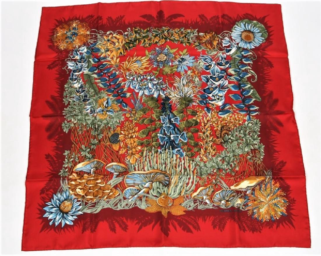 Hermes, "L'Ile Deserte" Silk Scarf in Red: Designed by Annie Faivre. "L'Ile Deserte". Silk. Designed 1998. Produced by Hermes. 35" x 35". "L'Ile Deserte" silk scarf in the red colorway designed by Annie Faivre for Hermes. Plant motif. Marked "