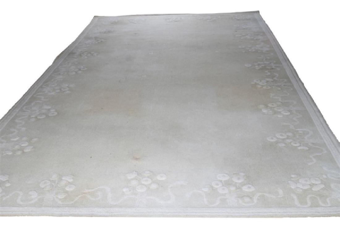 Edward Fields (American, 1913-1979), Rug: Edward Fields (American, 1913-1979). Wool. c. 1970. 20' 11" x 11'. Beige rug with floral pattern in a lighter beige. Pure wool pile label affixed to underside. Marked "Edward Fields" and "Copyright 19