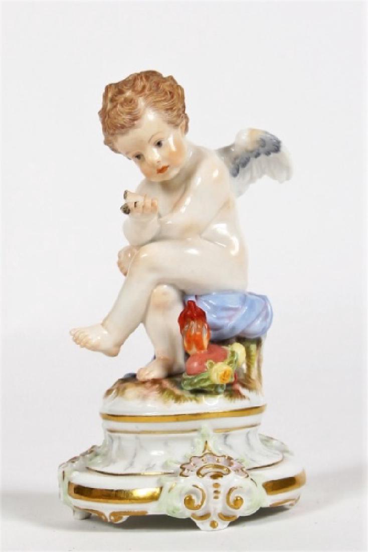 Meissen Porcelain Figurine, Cupid with Heart: Meissen (Germany, est. 1712). Porcelain, Late 19th - Early 20th C. Series: M 103. Height: 4 1/8", Base: 2 1/4" diameter. Figure depicts a seated cupid holding a heart. Underside of base displays under