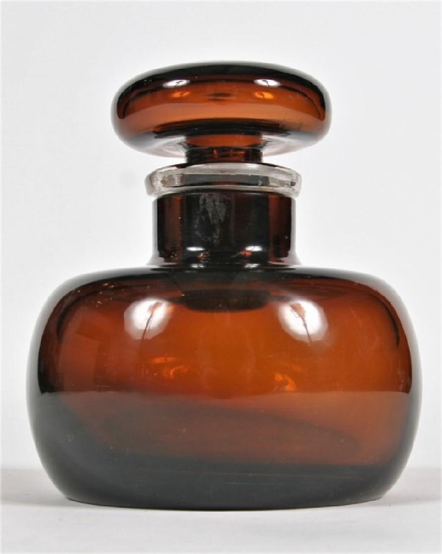 Paolo Venini (Italian, 1895-1959), Bottle: Paolo Venini (Italian, 1895-1959). Bottle with Stopper. Murano glass. c. 1950. Diameter (of base): 4 3/4", Height: 5 3/8". Bottle displays translucent brown and colorless glass, and maker's label on u