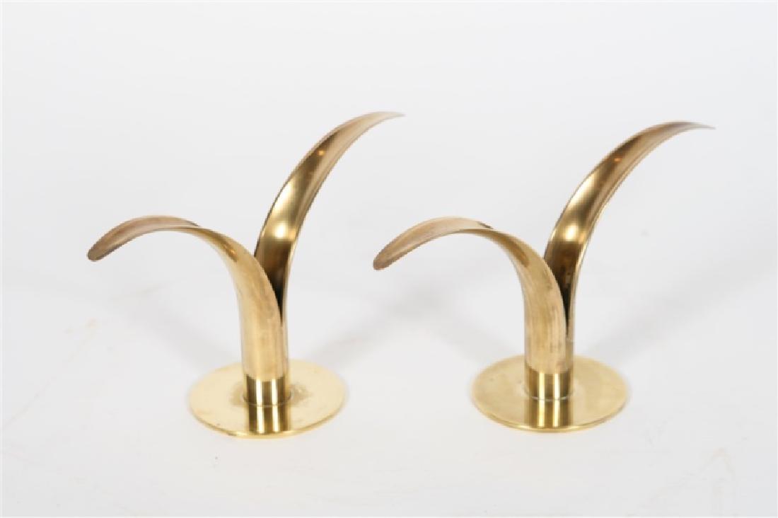 Ystad-Metall, Pair of "Lily" Brass Candlesticks: Ivar Alenius Bjork (1905-1978). "Lily" Candlesticks. Brass. c. 1960's. Manufactured by Ystad-Metall (Swedish, 1833-1969). Height: 5", Length: 8 3/4", Depth: 3 1/4". Pair of brass "Lily" candlesticks d