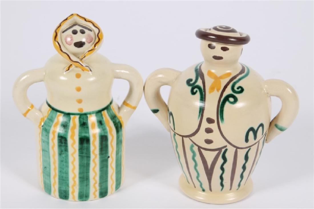 Eva Jancke-Bjork for Bo Fajans, Pair of Coin Banks: Eva Jancke-Bjork (Swedish, 1882-1981). Ceramic. Produced by Bo Fajans (Swedish, est. 1874). Model # 3505 and #3507. Female: Height: 6 1/2", Length: 5", Depth: 3 1/4". Male: Height: 6 1/4", Length: 6",