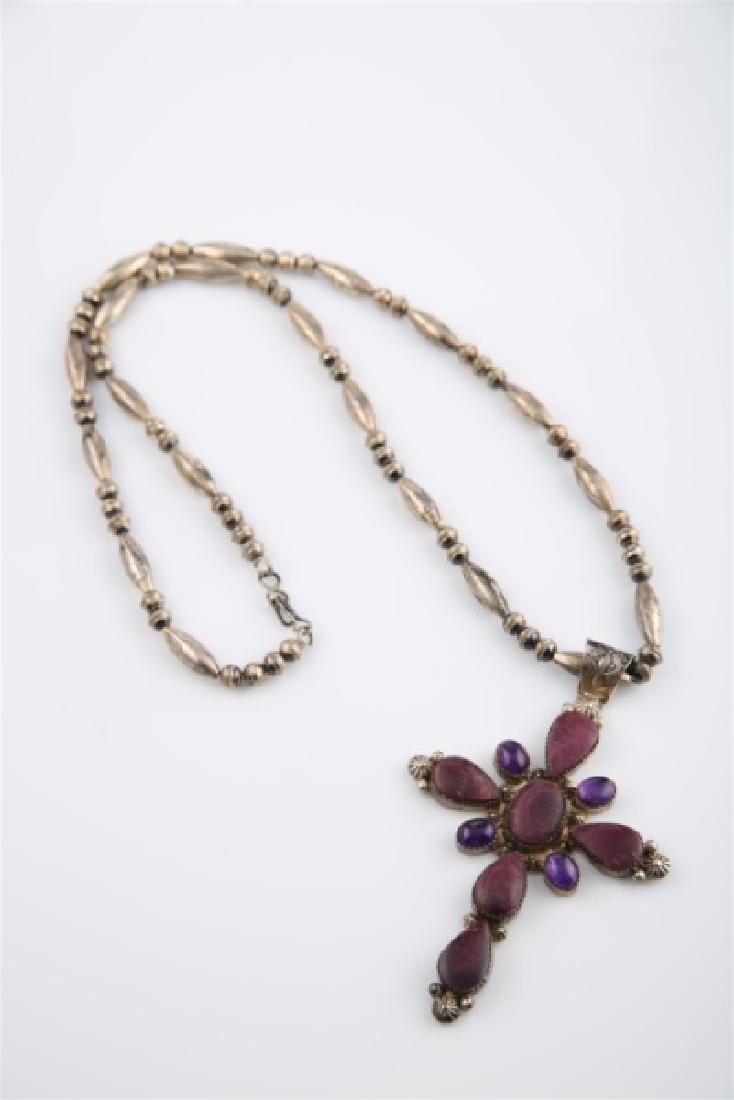 Ella Linkin Sterling Amethyst Cross Necklace: Ella Linkin (Native American). Sterling silver, amethyst. Necklace length: 27 1/2". Pendant length: 4". Weight: 1.885 ozt. Sterling silver and amethyst pendant necklace by Ella Linkin. Oblong and circ