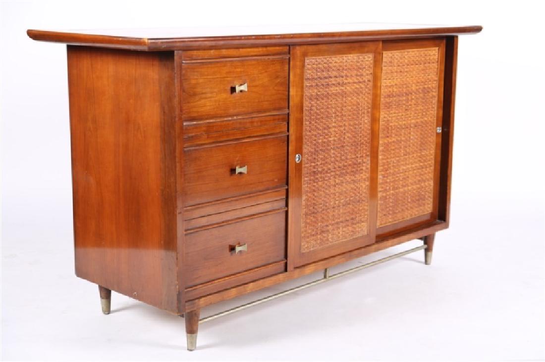 Weiman Furniture Company, Bypass Door Sideboard: Weiman Furniture Company (American, 20th century). Wood, brass. Model #235-59112. Height: 32 1/4", Length: 56", Depth: 20". Weiman mid-century lacquered top sideboard/credenza. Two-tone wood. Three sh