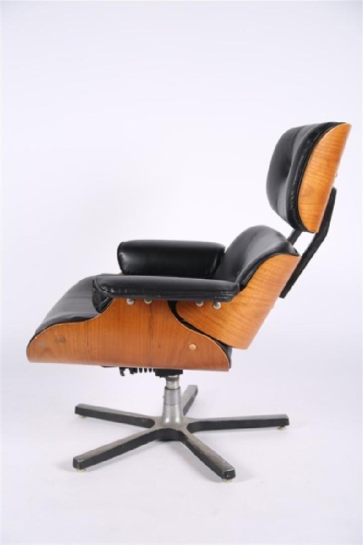 Reproduction Eames-Style Lounge Chair: Bentwood, vinyl upholstery. Height: 36", Length: 33", Depth: 39", Seat Height: 16". Reproduction Eames-style lounge chair. Black vinyl upholstery. Seat has reclining ability. Metal hardware to undersi