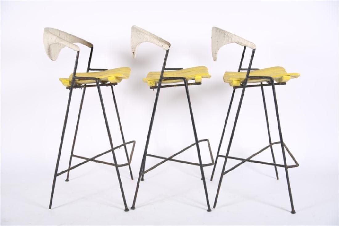Attributed to Arthur Umanoff, Three Bar Stools: Attributed to Arthur Umanoff. Wood, iron. c. 1950s-60s. Height: 40", Length: 19", Depth: 18", Seat Height: 29". Set of three wooden slat seat bar stools with iron frames attributed to Arthur Umanoff. 