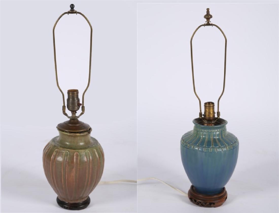 Pair of Pewabic-style Ceramic Jar Table Lamps: Ceramic, metal. Lamp 1: Height (with harp): 23 1/4", Dia.: approx. 8". Lamp 2: Height (with harp): 23 3/4", Dia.: approx. 8 1/2". Two Pewabic style ceramic jars converted into table lamps. Smaller lam