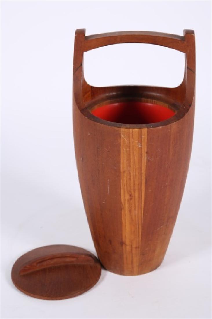 Jens Quistgaard for Dansk, Teak Ice Bucket: Jens Quistgaard (Danish, 1919-2008). Teak, plastic. c. 1950s. Manufactured by Dansk. Height: 19", Dia.: 8 1/2". Jens Quistgaard for Dansk teak ice bucket. Orange plastic interior liner. Circular lid.