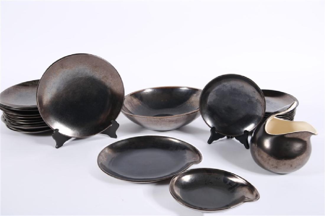 Eva Zeisel, Town & Country Dinner Set: Eva Zeisel (Hungarian, 1906-2011). 28 piece set, metallic brown gunmetal. Pottery. c. 1940's - 1950's. Distributed by Red Wing Pottery. Town & Country. Water Pitcher. Height: 8 1/4", Diameter: 5 1/8".