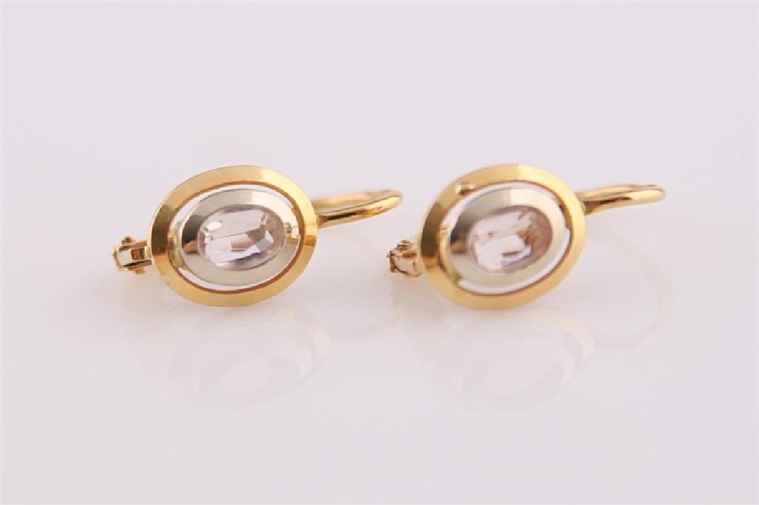Pair of 18kt Yellow Gold Lever Back Earrings: Pair of 18kt yellow gold lever back earrings. Each earring with pink stone to center, likely morganite. Marked "750". Length: 5/8". Weight: 2.3 g.