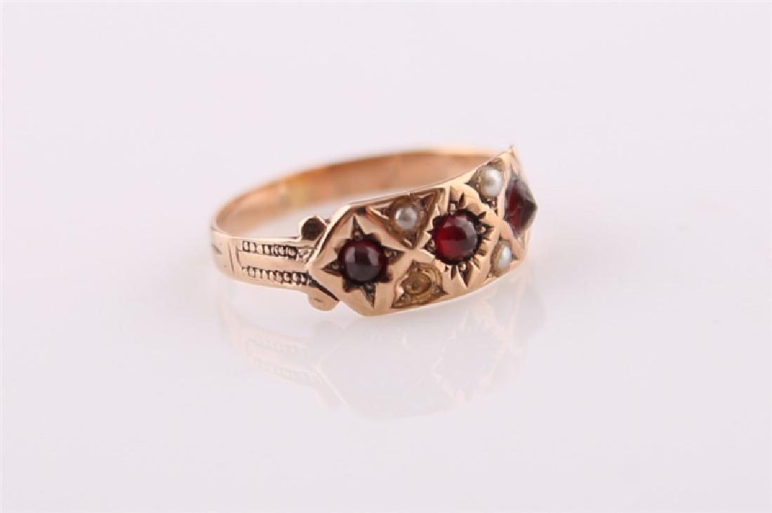 Rose Gold-Tone Ring with Garnet and Pearl: Rose gold-tone ring with garnets and seed pearls. Three garnets, three seed pearls. Interior of band marked "KE" and with faded script. Size: 5 1/4. Weight: 1.4 g.
