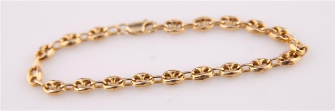 14k Italian Chain Link Bracelet: 14k chain link bracelet with Gucci-style chain. Stamped with both 14k and Italy. Length: 61/4 in. Weight: 4.7 grams.