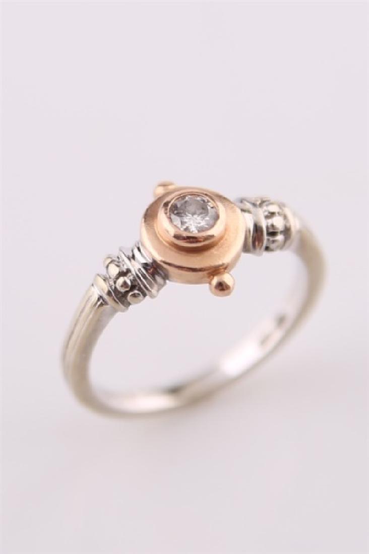 14kt Two-Tone Gold Ring with Diamond: 14kt two-tone diamond ring. Rose and white gold with central diamond approx. .15 ct. Interior of band stamped and marked ".155". Size: 6 3/4. Weight: 3.8 g.