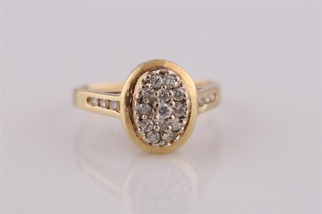Yellow Gold Ring with Diamond Cluster: Unmarked yellow gold ring with diamonds. Nineteen (19) diamonds of poor quality totaling approx. .2 cts. Size: 5. Weight: 2.9 g.