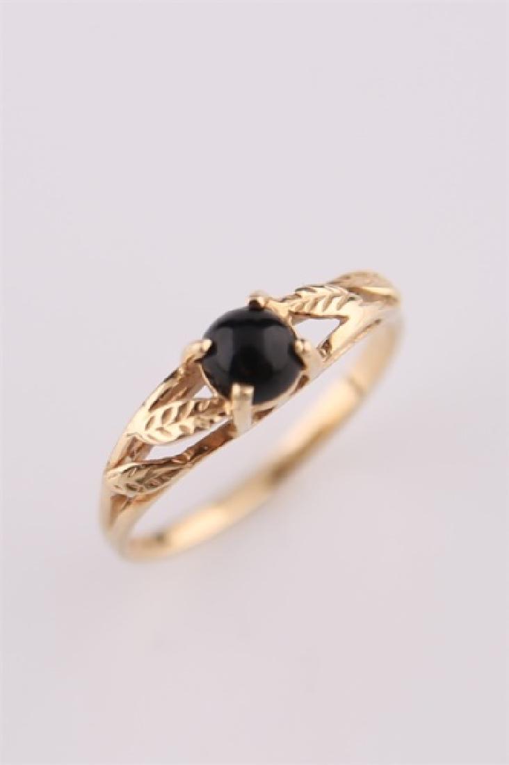 14kt Yellow Gold Ring with Onyx: 14kt yellow gold ring with leaf motif and black onyx central stone. Interior of band marked "14K" with "M" maker's mark. Size: 6 3/4. Weight: 1.9 g.