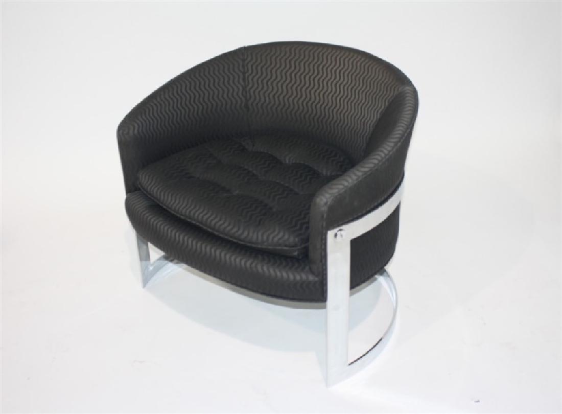 Style of Milo Baughman, Chrome Frame Chair: Chromed metal, upholstery. Height: 26 1/4", Length: 30", Depth: 31", Seat Height: 17". Chromed metal frame upholstered chair. Barrel back shape with removable seat cushion. Dark gray upholstery. Appea