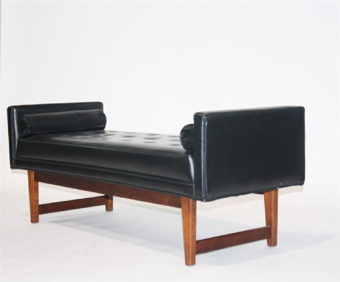 Selig Manufacturing Co., Black Upholstered Bench: Selig Manufacturing Co. Walnut, upholstery. 20th century. Height 21", length 52 1/2", depth 19 5/8". Sofa bench having tufted black upholstery and a walnut frame. With two associated cylindrical pillo