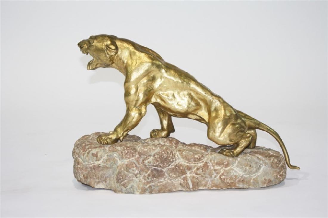 After Thomas Francois Cartier, Panther Sculpture: After Thomas Francois Cartier (French, 1879-1943). Metal, stone. Height: 16", Length: 24 1/2", Depth: 8 1/2". Cast metal sculpture depicting a growling panther on a pink stone base. Gilt cast metal. S