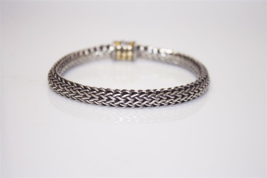 925 & 18kt John Hardy Snake Chain Bracelet: 925 and 18kt John Hardy Snake Chain Bracelet. 925 sterling silver John Hardy snake chain bracelet with 18kt yellow gold circle detail around the push button clasp. Clasp marked "JH", "925" and "18K".