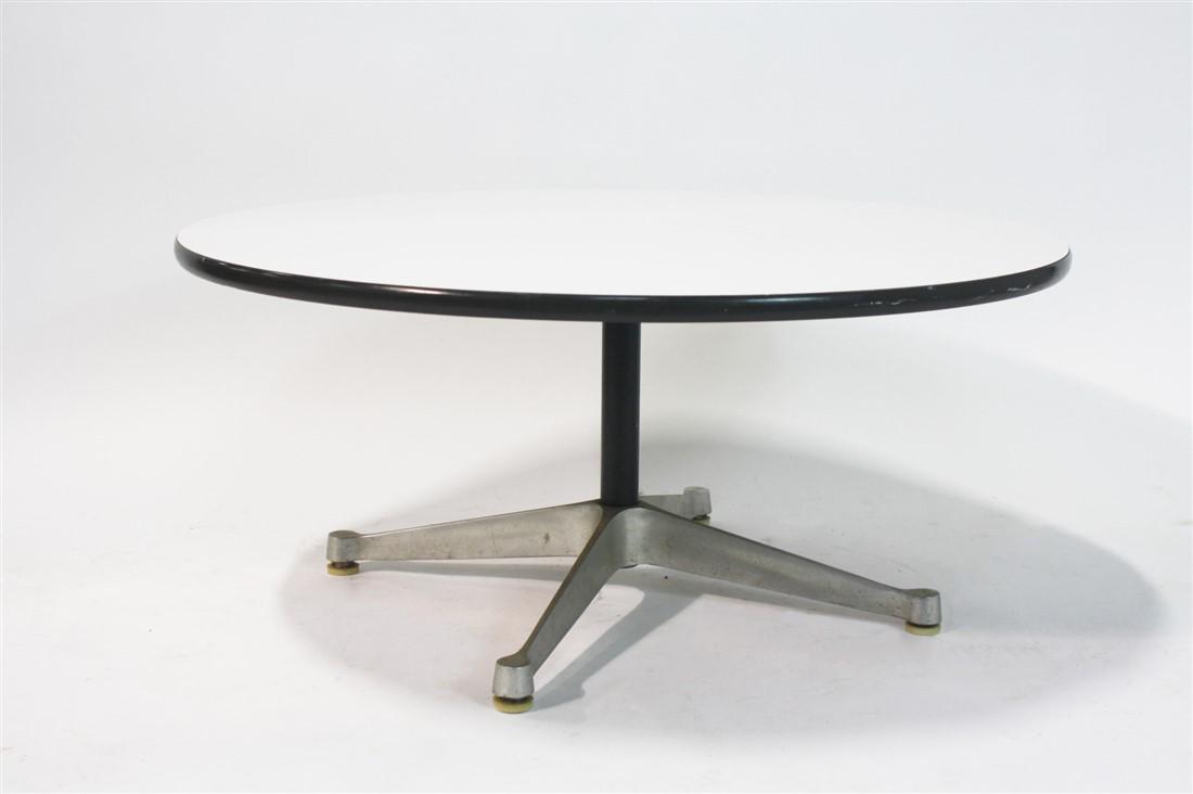 Eames for Herman Miller, Round Coffee Table: Charles and Ray Eames (American, 20th C.). Wood, metal, plastic. Manufactured by Herman Miller. Model: 651. Height: 16 1/4", Dia.: 36". Low coffee table with plastic material top. Metal base. Round He
