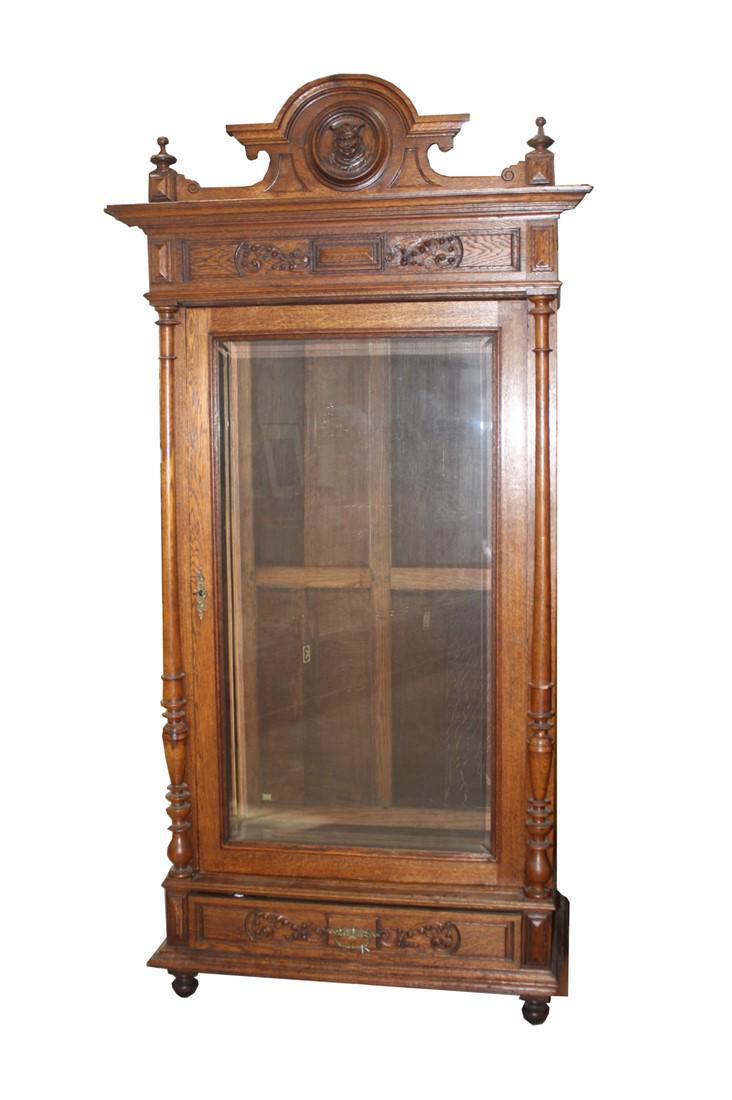 Henri II Style Armoire: Walnut. c. late 19th century. Height: 83 1/4", Length: 44 1/2", Depth: 25". French Henri II style armoire. Armoire with ornately carved cornice and base, with glass door flanked by two columns. Armoir