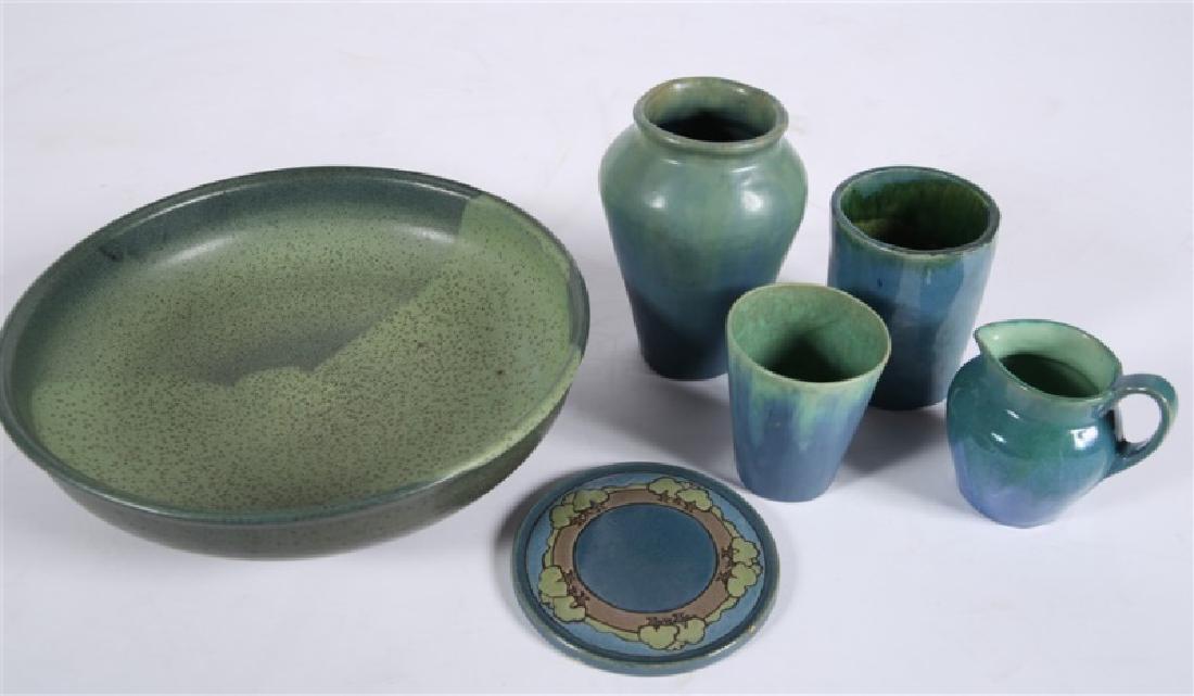 Lot of Six Blue-Green Glazed Ceramics: Glazed ceramics. Vase 1: Height: 7 1/4", Dia.: approx. 5". Vase 2: Height: 5", Dia.: 4". Cup: Height: 4", Dia.: 3 1/2". Creamer: Height: 4 1/4", Length: 4 3/4", Depth: approx. 3 1/2". Trivet: Height: