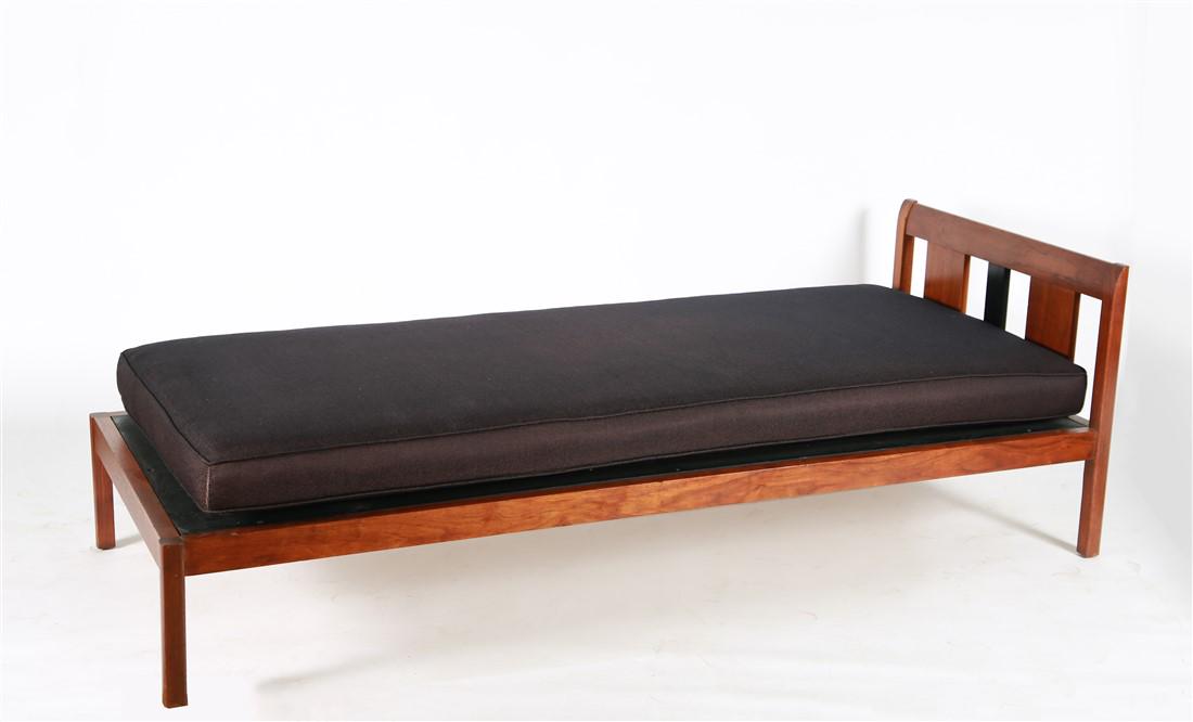 Mid-Century Wood Frame Day Bed: Wood, upholstery. c. mid-20th century. Height: 25", Length: 77 3/4", Depth: 31 3/4". Wood frame day bed with black contrasting segment to headboard. Danish or mid-century style. Black upholstered cush