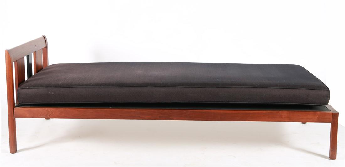 Mid-Century Wood Frame Day Bed: Wood, upholstery. c. mid-20th century. Height: 25", Length: 77 3/4", Depth: 31 3/4". Wood frame day bed with black contrasting segment to headboard. Danish or mid-century style. Black upholstered cush