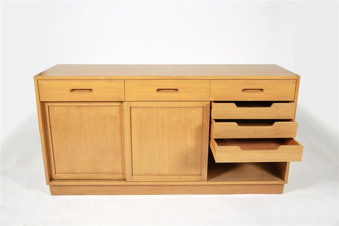 Edward Wormley for Dunbar, Sliding Door Cabinet: Edward J. Wormley (American, 1907-1955). Sliding door cabinet. Laminated wood. c. 20th century. Manufactured by Dunbar. Model 5668 variant. Height: 32 1/8", Length: 61 1/2", Depth: 18 1/4". Edward Wor