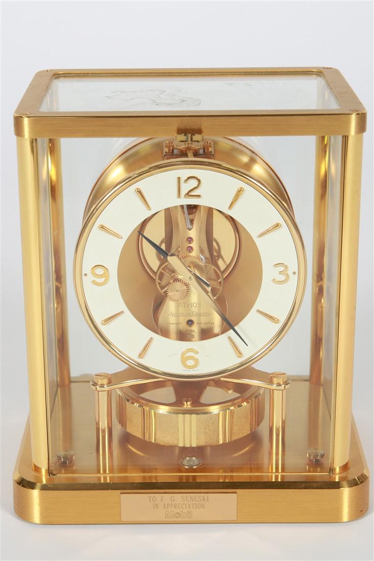 Jaeger-LeCoultre, Atmos Clock: Jaeger-LeCoultre (Swiss est. 1833) Atmos clock. Brass and glass. Height: 9", Width: 8", Depth: 6". Jaeger LeCoultre 13 jewel 540 caliber movement polished brass mantel clock with an Atmos mechanical t