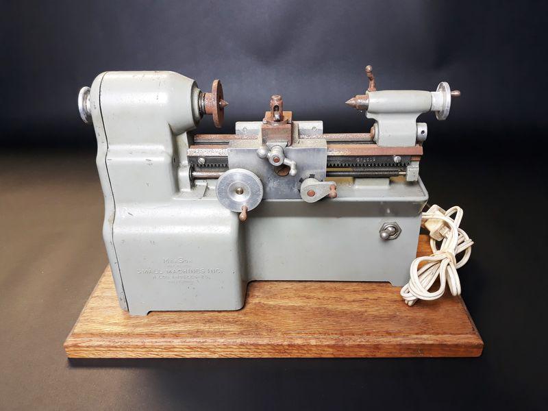 ManSon Electric Metal Lathe: Small Machines Inc. ManSon Metal Lathe. Metal, Wood. c. 1950. 10.25" x 7" x 3.25".