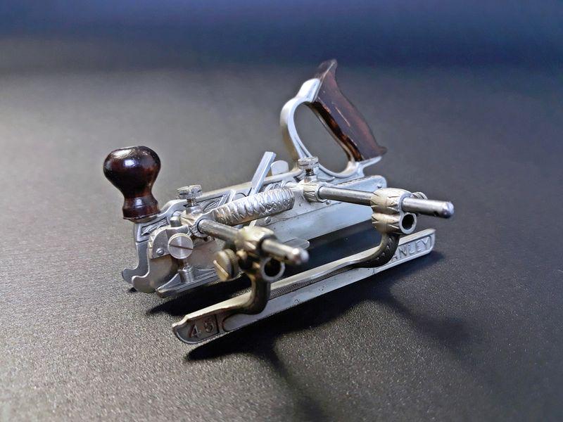 Miniature Stanley #45 Plane: Paul Hamler. Steel, Brass. c. 2000. 2.25" x 3.25" x 2.65".