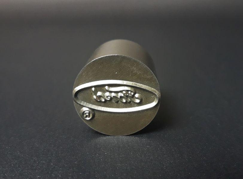 Ford Logo Metal Stamp: Ford Motor Company. Steel. c. 1960s. 1.2" x 1.2".