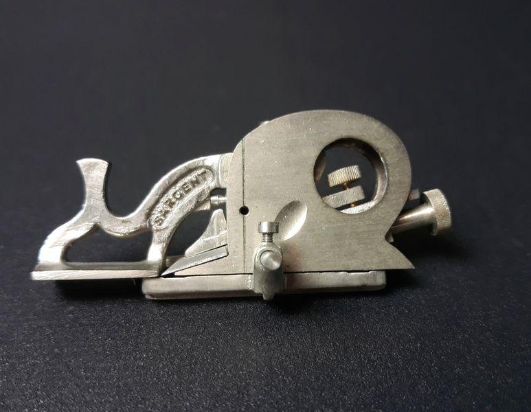 Miniature Sargent Ladybug Plane: Paul Hamler. Steel, Aluminum. c. 2000. 1.00" x 2.25" x 1.2".