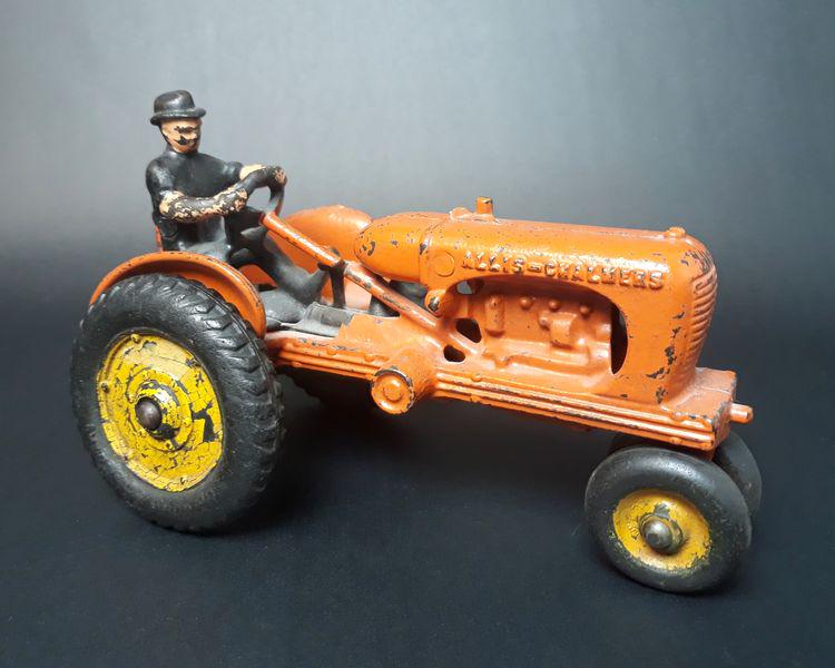 Allis Chalmers Cast Iron Toy Tractor: Allis-Chalmers Manufacturing Co. Cast Iron. c. 1940s. 4.25" x 4.10" x 6.75".