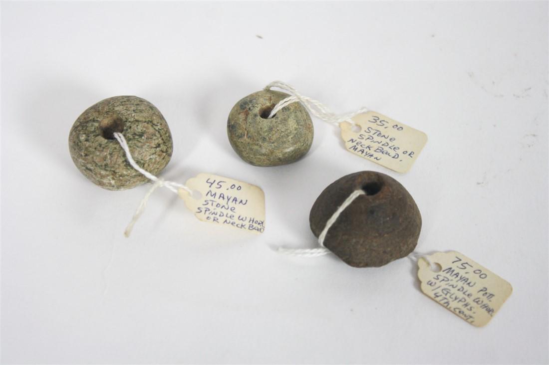 Three Maya Neck Beads: Stone. c. 500 AD. Largest stone diameter: 1 1/2". Three Maya neck beads / spindle whorls. Provenance: From the collection of Mr. Andrew Weertz, owner of Ports of Call, Ltd. import store in Grosse Poin