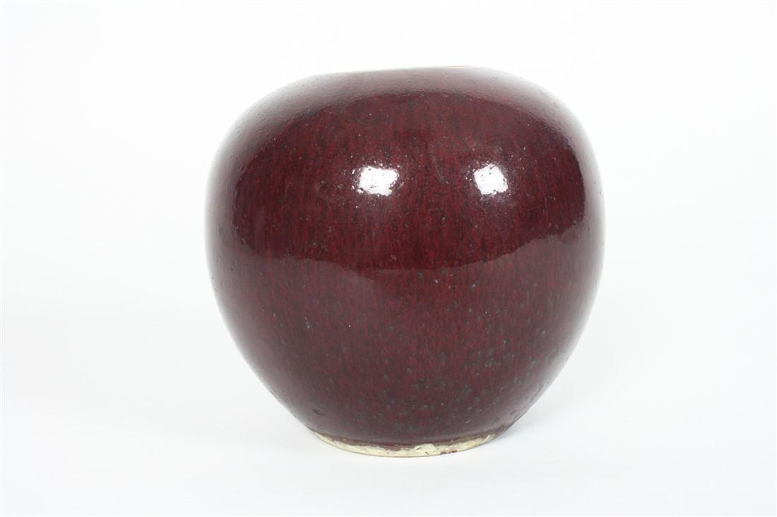 Sang de Boeuf Red Vase: Chinese bowl. Ceramic. c. 18th C. Height: 6", Diameter: 6". Ceramic vase with red glaze and mint green glazed interior. Tag reads, "Vase, Round, Sang De Boeff Glaze 18th C." Provenance: From the colle