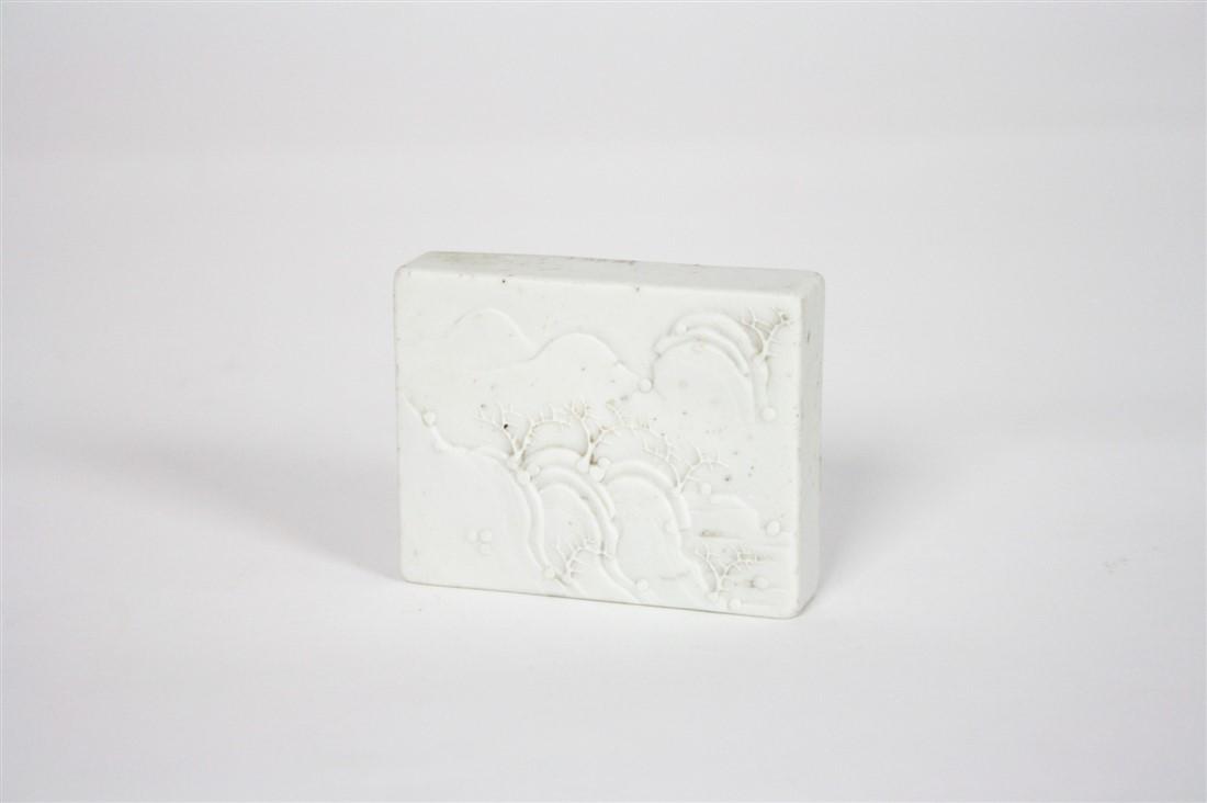 Tao Kuang Paper Weight: Alabaster. c. 1821-1850. Height: 2 1/2", Length: 2", Depth: 1/2". Alabaster relief of a landscape with cherry blossom trees and hills. Likely from the Tao Kuang period. Provenance: From the collection