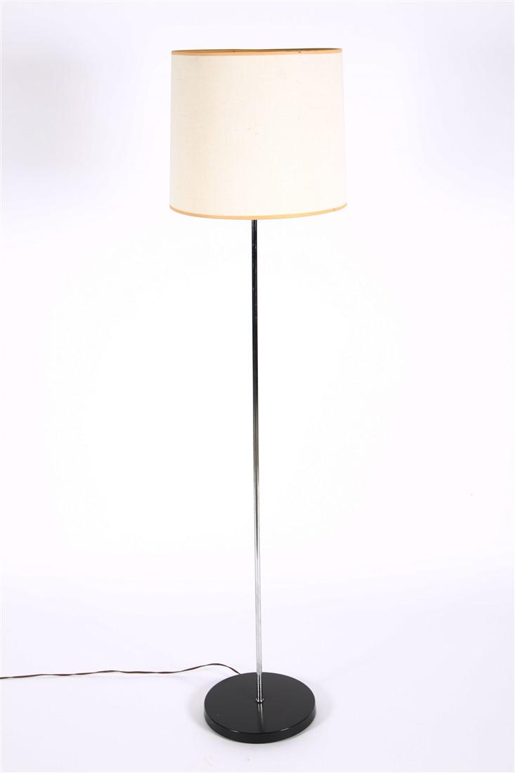Mid-Century Chrome Floor Lamp: Chromed metal. Height (including harp): 55", Dia.: 10". Chromed metal floor lamp. Heavy iron base. Appears unmarked. Functional.