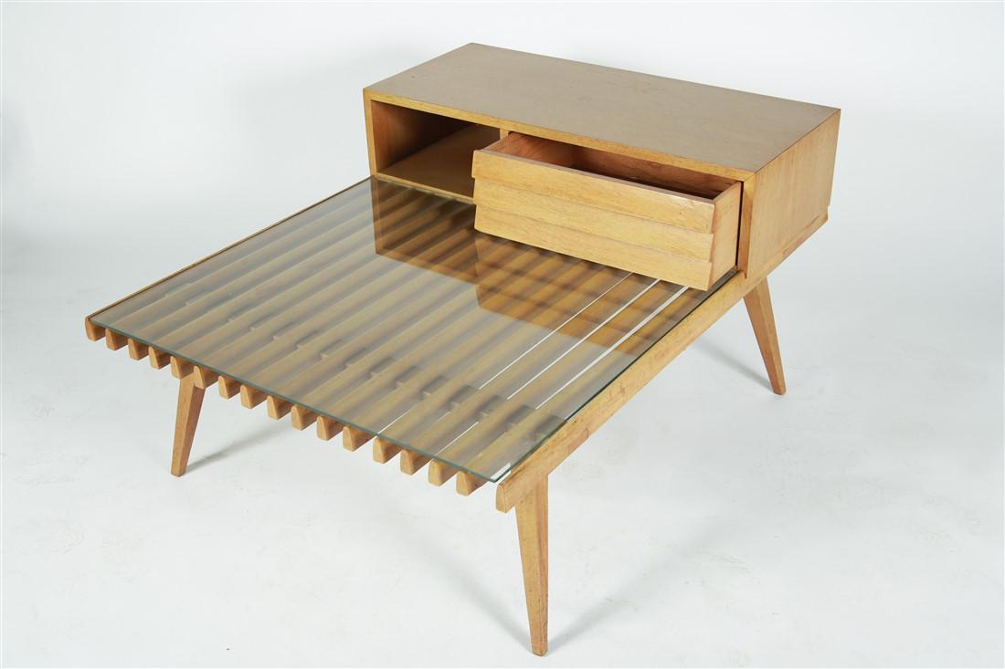 Modern by Founders, Side Table: Modern by Founders. Side table. Glass and bleached mahogany. Height: 22", Width: 32 3/4", Length: 42". Modern by Founders side table with one pull out drawer and glass top. Marked to inside of louvere