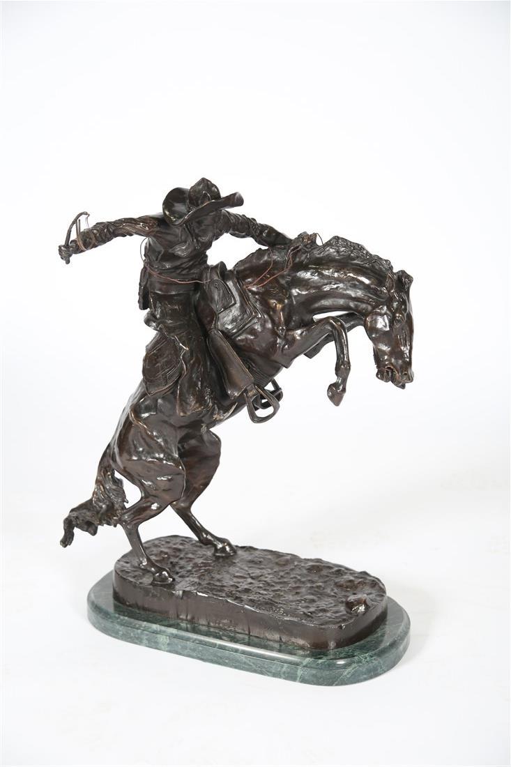 After Frederic Remington, "Bronco Buster" Bronze: After Frederic Remington (American, 1861-1909). "Bronco Buster". Bronze. Height: 24", Length: 18", Depth: 10". After Frederic Remington, "Bronco Buster" restrike. Bronze sculpture upon marble base. Si