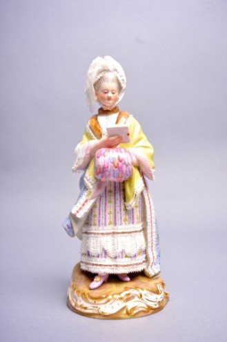 Meissen, Figure, Acier & Schoenheit, Race Goer: from the model by Michel Victor Acier with the assistance of Johann Carl Schoenheit, mid-19th century, marked with blue crossed swords, incised "D66," impressed " 43" and hand painted 19, 8" high.