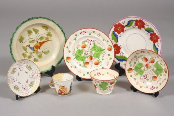 Assembled Group of Pottery and Porcelain, 19th cen: Including a cream ware & strawberry decorated plate & cup and saucer, a Leeds cream ware plate, a Meissen tea cup and other. Largest Plate D: 8" Condition: Meissen tea cup is repaired. Leeds plate has