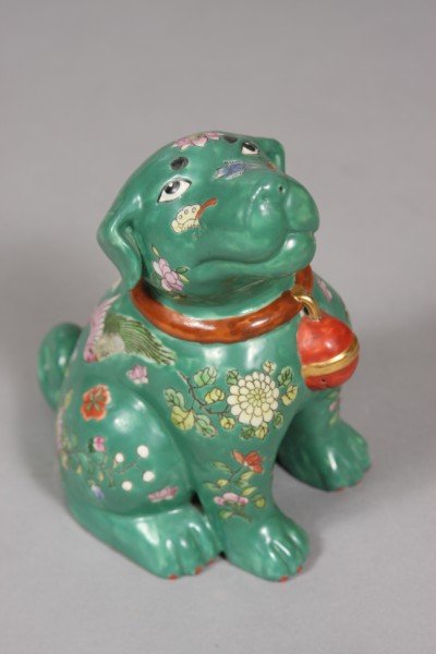 Chinese Green Glazed Foo Dog, 20th Century, 9" hig: Pottery dog, signed, enameled on green background color with rusts, celadon, pink white and blue, with birds and flowers motif with a brown collar and rust well with gold trim. Condition: Good, with s